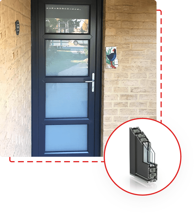 Dark grey hinged double glazed door with three frosted glass panels, set in a brick exterior wall, with inset showing door frame cross-section.